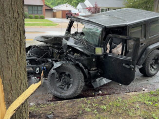 Black Jeep Wrangler after a crash with another vehicle, a light pole, and a tree on Wilke Road south of Campbell Street in Arlington Heights, Friday, June 5, 2026 (CARDINAL NEWS)