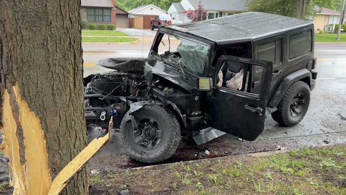 Black Jeep Wrangler after a crash with another vehicle, a light pole, and a tree on Wilke Road south of Campbell Street in Arlington Heights, Friday, June 5, 2026 (CARDINAL NEWS)