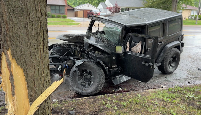 Black Jeep Wrangler after a crash with another vehicle, a light pole, and a tree on Wilke Road south of Campbell Street in Arlington Heights, Friday, June 5, 2026 (CARDINAL NEWS)