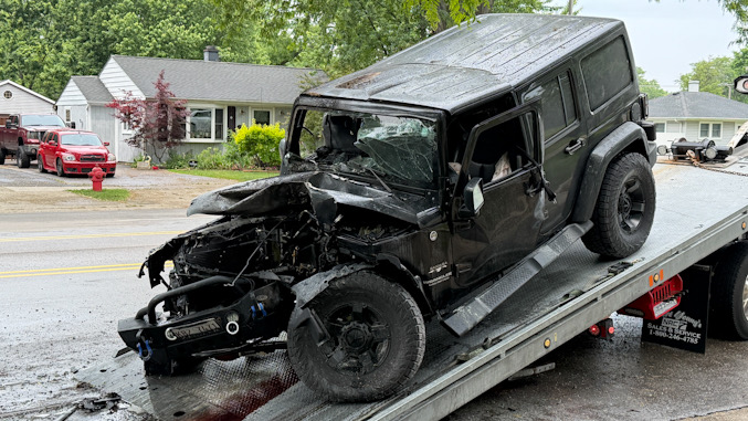 Black Jeep Wrangler on a flatbed tow after a crash on Wilke Road south of Campbell Street in Arlington Heights, Friday, June 5, 2026 (CARDINAL NEWS)