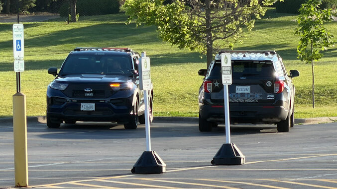 Arlington Heights police officers on scene at Thomas Middle School after search for a male adult that allegedly tried to attack a father and son on a bike ride near Douglas Avenue and Olive Street in Arlington Heights (CARDINAL NEWS)