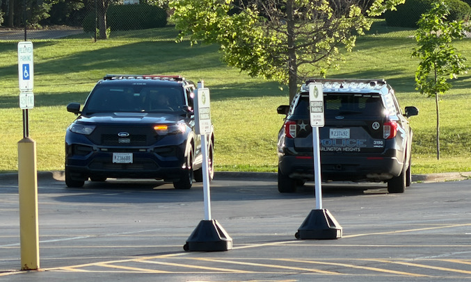 Arlington Heights police officers on scene at Thomas Middle School after search for a male adult that allegedly tried to attack a father and son on a bike ride near Douglas Avenue and Olive Street in Arlington Heights (CARDINAL NEWS)