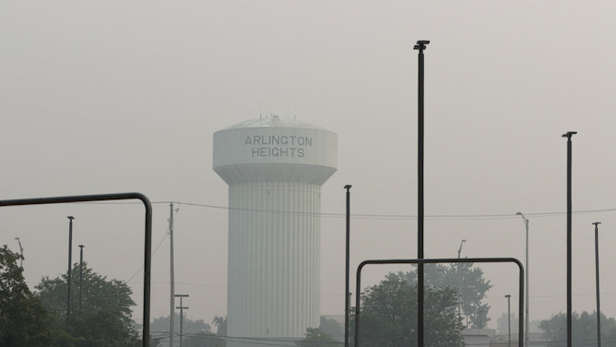 Arlington Heights south water tower in hazy, smoke-filled air with an AQI of about 877 between 4:30 p.m. and 5:00 p.m. Thursday, July 16, 2026 (CARDINAL NEWS).