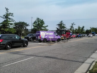 Crash scene shows a purple van "The Clean Genius" wrecked at the scene of a crash with a lot of debris on the road Friday morning, July 24, 2026 (CARDINAL NEWS/provided photo).