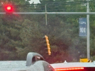 Stoplight broken from its mount from an overhead standard about 1:40 p.m. Friday, July 3, 2026 at Arlington Heights Road and Central Road in Arlington Heights (PHOTO CREDIT: Ben Murphy)