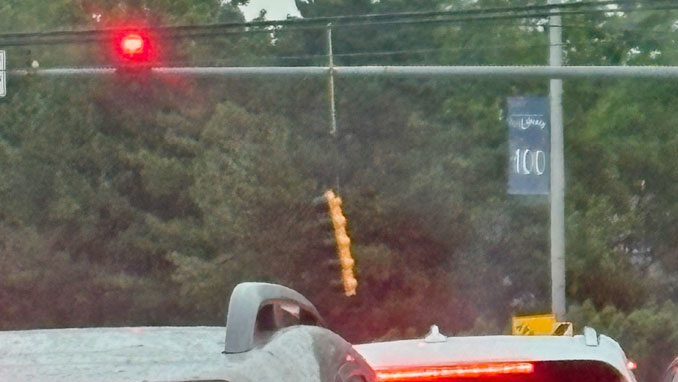 Stoplight broken from its mount from an overhead standard about 1:40 p.m. Friday, July 3, 2026 at Arlington Heights Road and Central Road in Arlington Heights (PHOTO CREDIT: Ben Murphy)